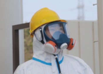 Nuclear worker in protective gear.